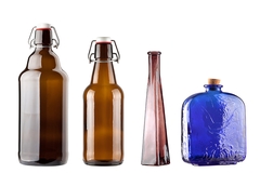 Image Assorted glass bottles upright